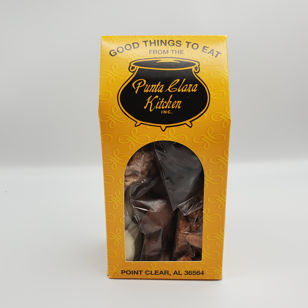 Yellow packaging box with 'Punta Clara Kitchen' branding conatining assorted coated pecans