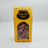Yellow decorative box from Punta Clara Kitchen with a clear window showing butter crunch flavored pecans