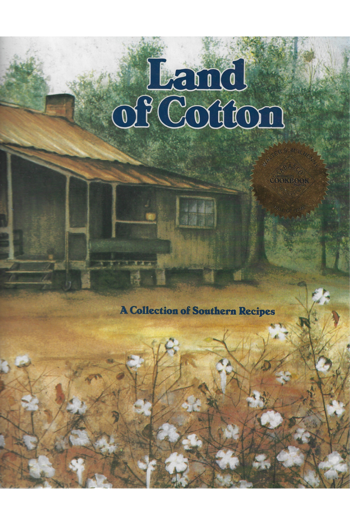 cookbook cover of 'Land of Cotton' with a cabin and cotton field illustration.