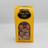 Yellow Punta Clara Kitchen box with transparent window showing sugar flavor coated pecans