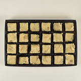Candy box tray of square pieces of vanilla fudge