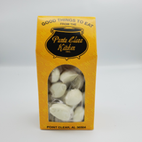 Yellow box from Punta Clara Kitchen showing white chocolate coated pecans